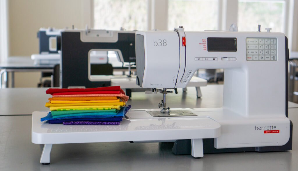 Bernette B38 sewing machines with rainbow of fabrics